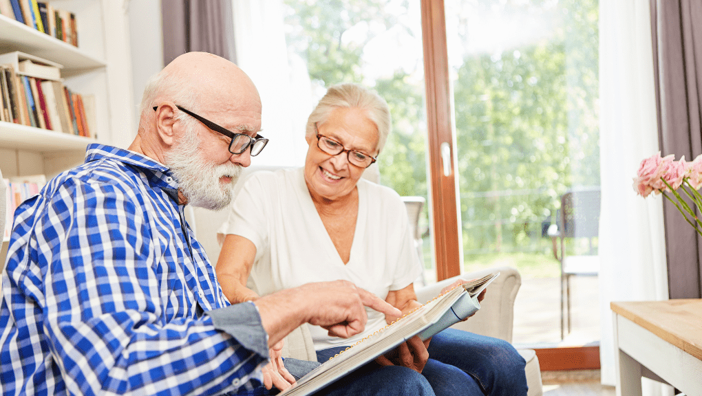Transition to Assisted Living elderly looking at a photo album transition to assisted living